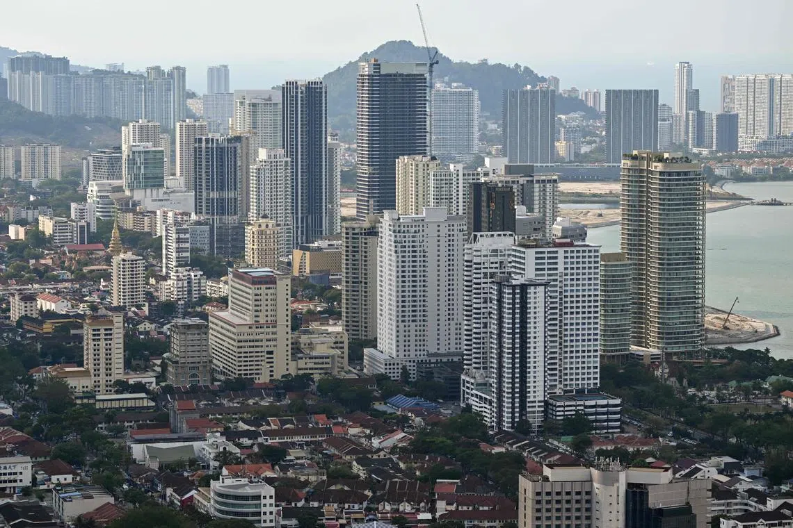 A general view shows residential and commercial buildings in Georgetown on Penang island in Malaysia on March 10, 2023. (Photo by Mohd RASFAN / AFP)