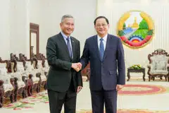 Lao Prime Minister Sonexay Siphandone (right) with Singapore Foreign Minister Vivian Balakrishnan in Vientiane in January 2024. The Lao leader will visit Singapore on Jul 9. 