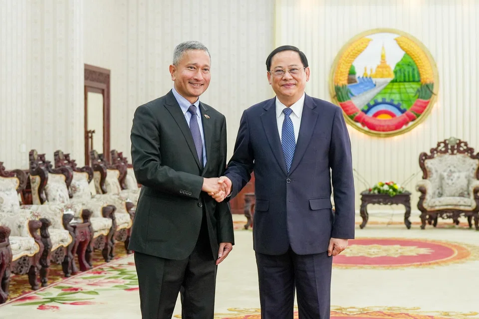 Lao Prime Minister Sonexay Siphandone (right) with Singapore Foreign Minister Vivian Balakrishnan in Vientiane in January 2024. The Lao leader will visit Singapore on Jul 9. 