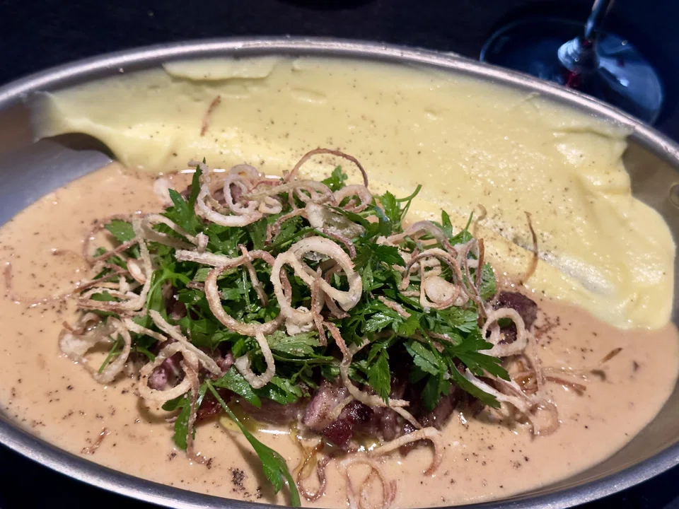 Tender iberico pork in buttery vin jaune sauce and creamy potatoes.