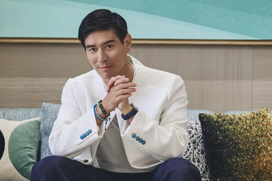 Evan Kwee has many hotel openings in the pipeline. He wears a white T-shirt, off-white cardigan, navy blue trousers and Escale Worldtime watch, all from Louis Vuitton. 