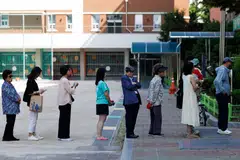 Voters line up at a polling station during the presidential election in Seoul, South Korea, June 3, 2025. 