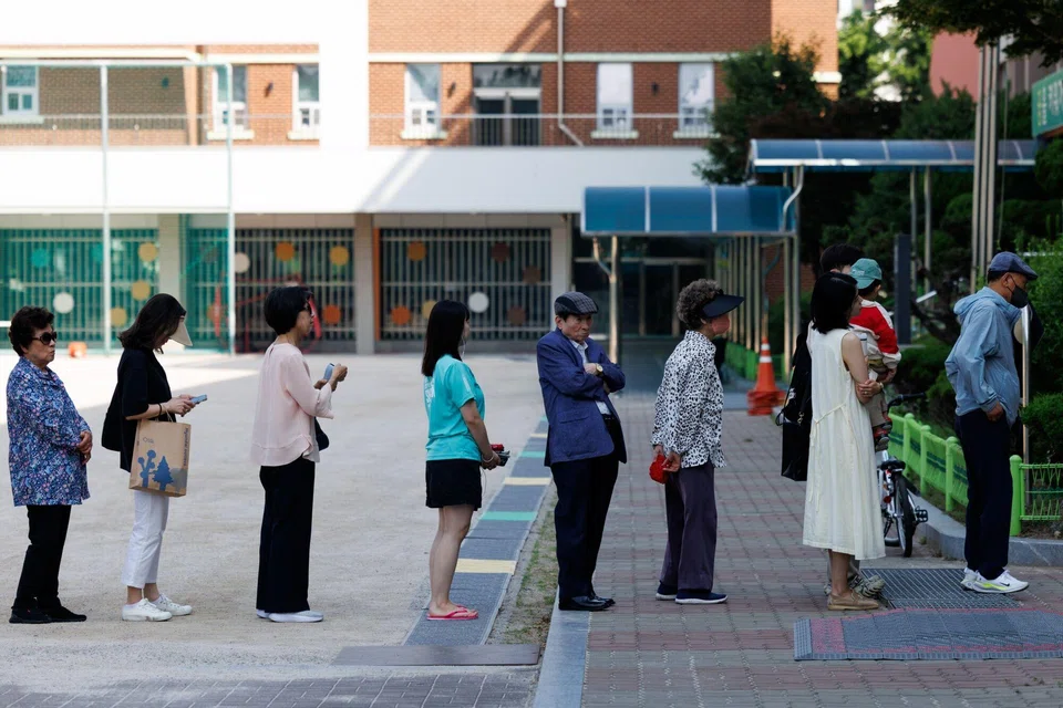 Voters line up at a polling station during the presidential election in Seoul, South Korea, June 3, 2025. 