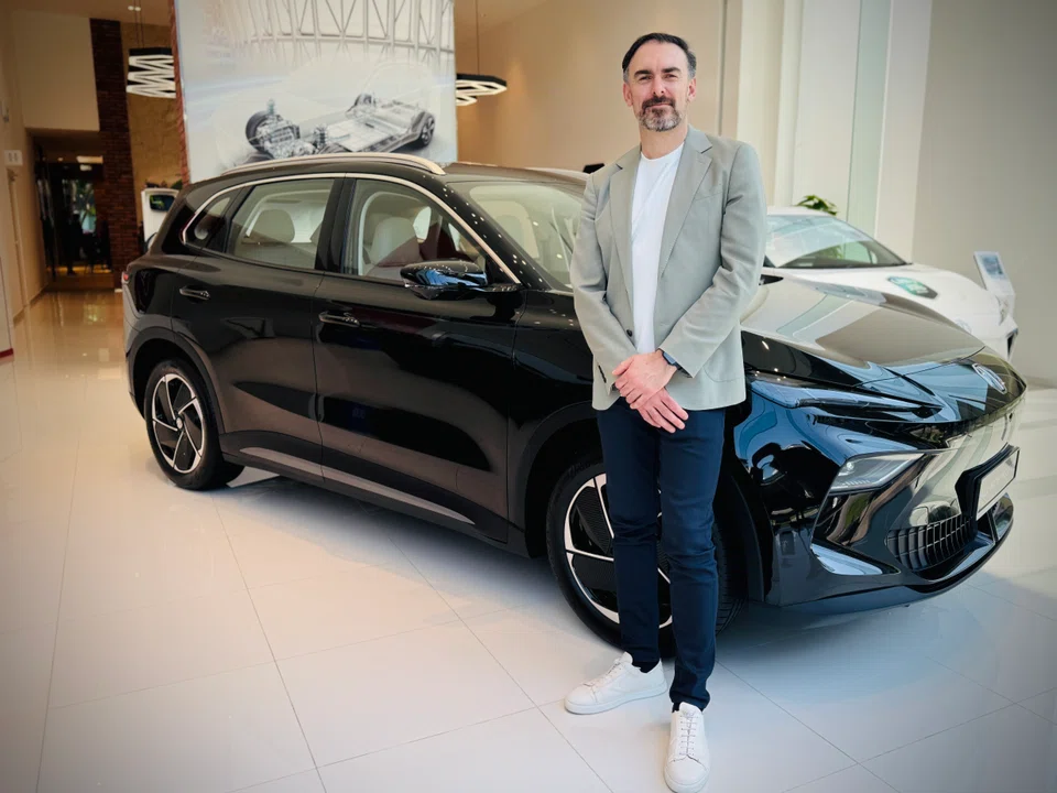 Carl Gotham, advanced design director at SAIC Design's London studio, with the new MGS5. MG launched the compact sport utility vehicle in Singapore on Apr 9 to take on the wildly popular BYD Atto 3.