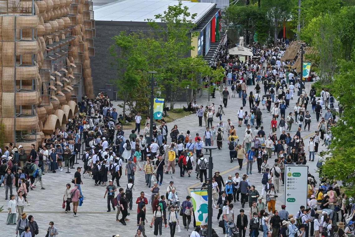 Crowds queue up for events at various pavilions during the 2025 Osaka Expo in the city of Osaka on May 21, 2025. The number of foreign visitors to Japan soared 28.5 percent in April year-on-year to a record 3.91 million, official figures showed on May 21. (Photo by Richard A. Brooks / AFP)