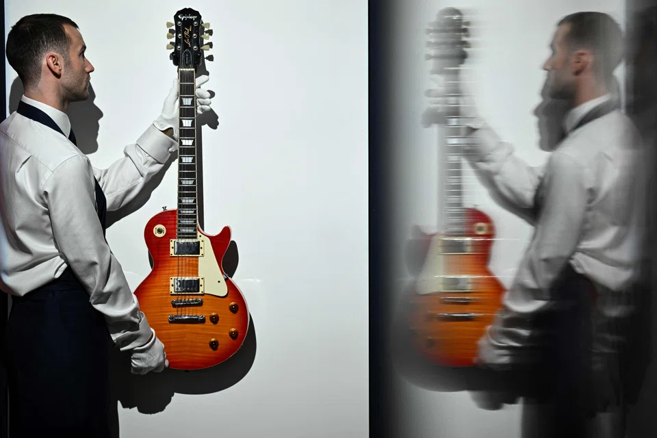 Noel Gallagher's Epiphone Les Paul Standard guitar was sold well above its £80,000 estimate, the Sotheby's auction house said.