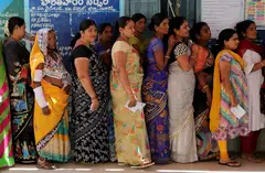 Voters in line in Telangana, India. The Election Commission of India is going to great lengths to ensure a green election, but Indian voters are primarily concerned with unemployment and inflation.