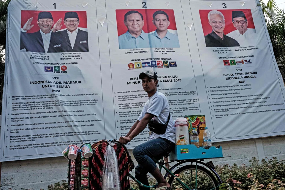 Posters of the presidential and vice-presidential candidates in Jakarta. Though politics swirl, especially with the upcoming general election in Indonesia, comparatively, the risks appear containable and the prospects for Asean are good.