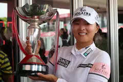 South Korean golfer Ko Jin-young celebrates with the trophy after winning the HSBC Women's World Championship golf tournament at the Sentosa Golf Club in Singapore on March 5, 2023.