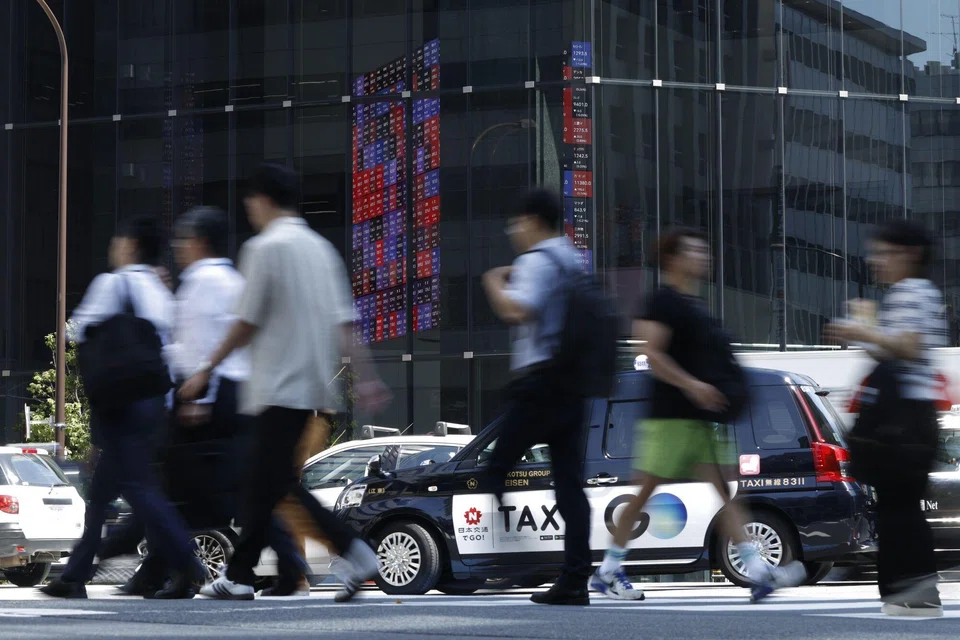 Share prices being displayed inside the Kabuto One building in Tokyo. Call overwriting is especially appealing in Japan, where interest rates remain some of the lowest among developed markets. 