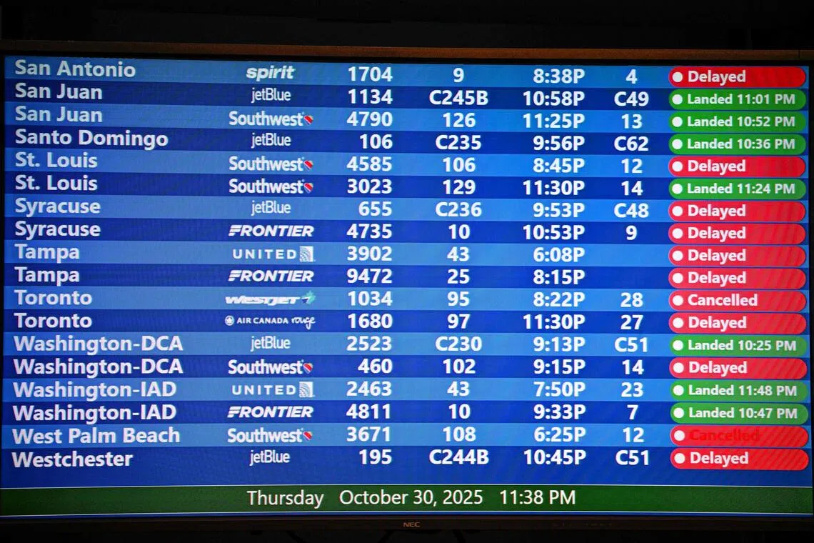 Cancelled flights are seen on a screen at Orlando International Airport in Orlando, Florida, Oct 30, 2025. The shutdown has forced 13,000 air traffic controllers and 50,000 Transportation Security Administration officers to work without pay and snarled tens of thousands of flights.