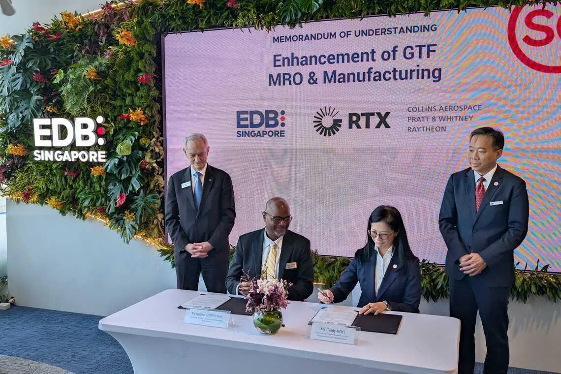 Pratt & Whitney's senior vice-president of commercial engines operations Robert Griffiths (left, seated) and executive vice-president of EDB Cindy Koh at the MOU signing ceremony at Singapore Airshow 2026.