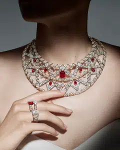 Destiny necklace in platinum and yellow gold with rubies and diamonds; ring in white gold with diamonds; ring in platinum and yellow gold with ruby and diamonds.



