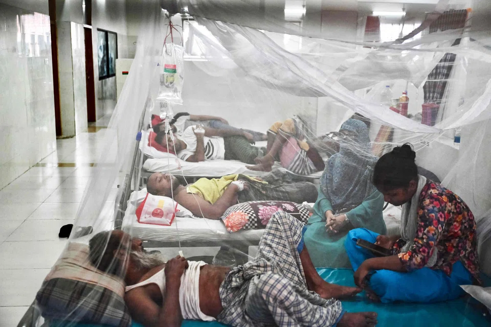 Dengue patients receiving treatment at a hospital in Dhaka. The WHO says the number of reported dengue cases has almost doubled each year since 2021, with over 12.3 million cases, including more than 7,900 deaths in the first 8 months of 2024.