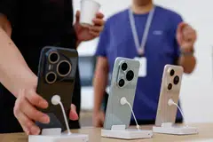 Huawei Pura 80 smartphone series are displayed at a Huawei's flagship store in Beijing, China Jun 11.