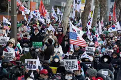 Supporters of former South Korean President Yoon Suk Yeol shout slogans as they rally outside the Seoul Central District Court in Seoul, South Korea, Feb 19, 2026. 