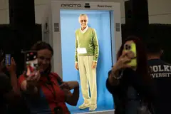 Fans can interact with a hologram of Stan Lee in an enclosed booth at the Los Angeles Convention Center.