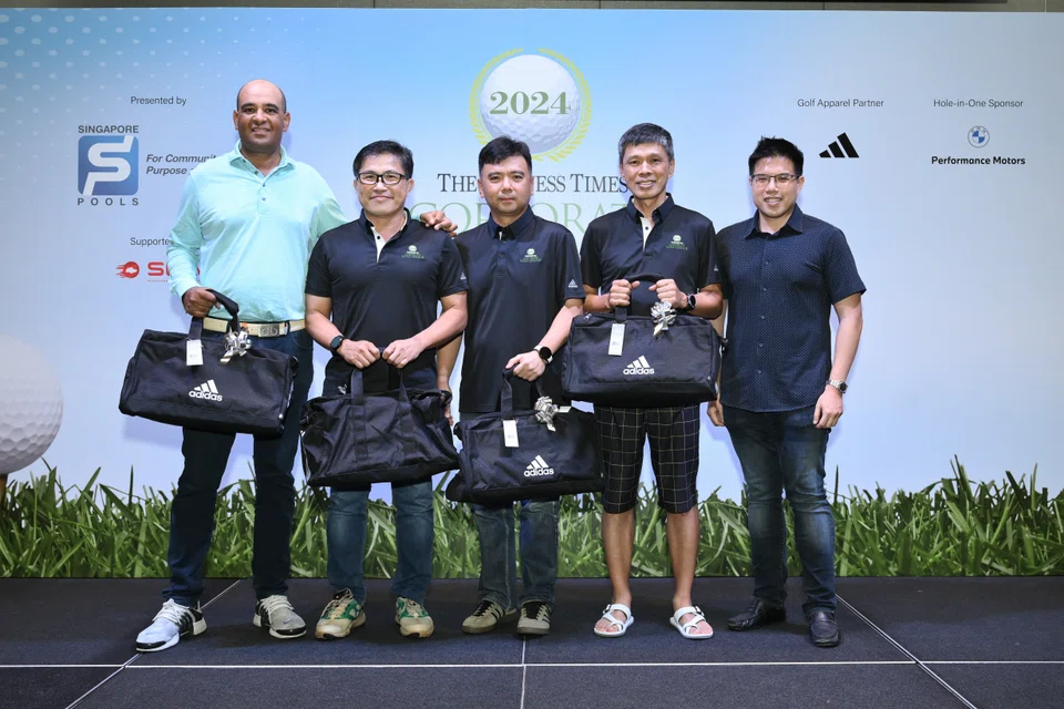 (From left) Team Singapore Pools golfers Samir Bedi, Tay Boon Khai, Kevin Pang and Gerald Ng, after receiving their prizes from The Business Times news editor Lee U-Wen at Tanah Merah Country Club.