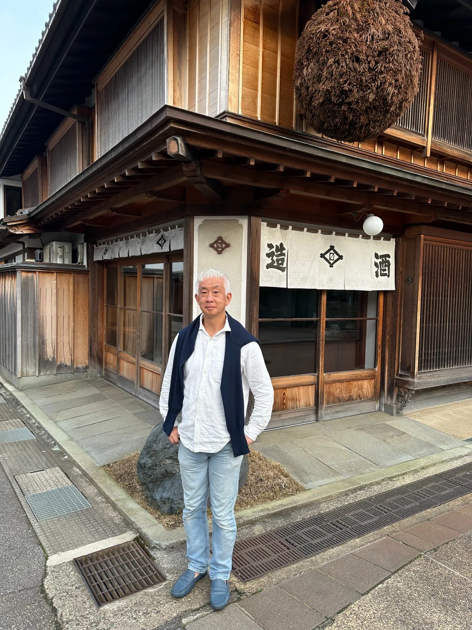 Ryuichiro Masuda outside his family brewery, Masuda Shuzo.