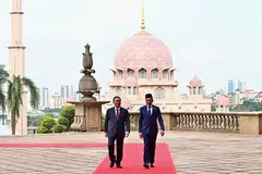 China's Premier Li Qiang with Malaysian Prime Minister Anwar Ibrahim at Putrajaya. Li is on the third leg of a trip that has included New Zealand and Australia.