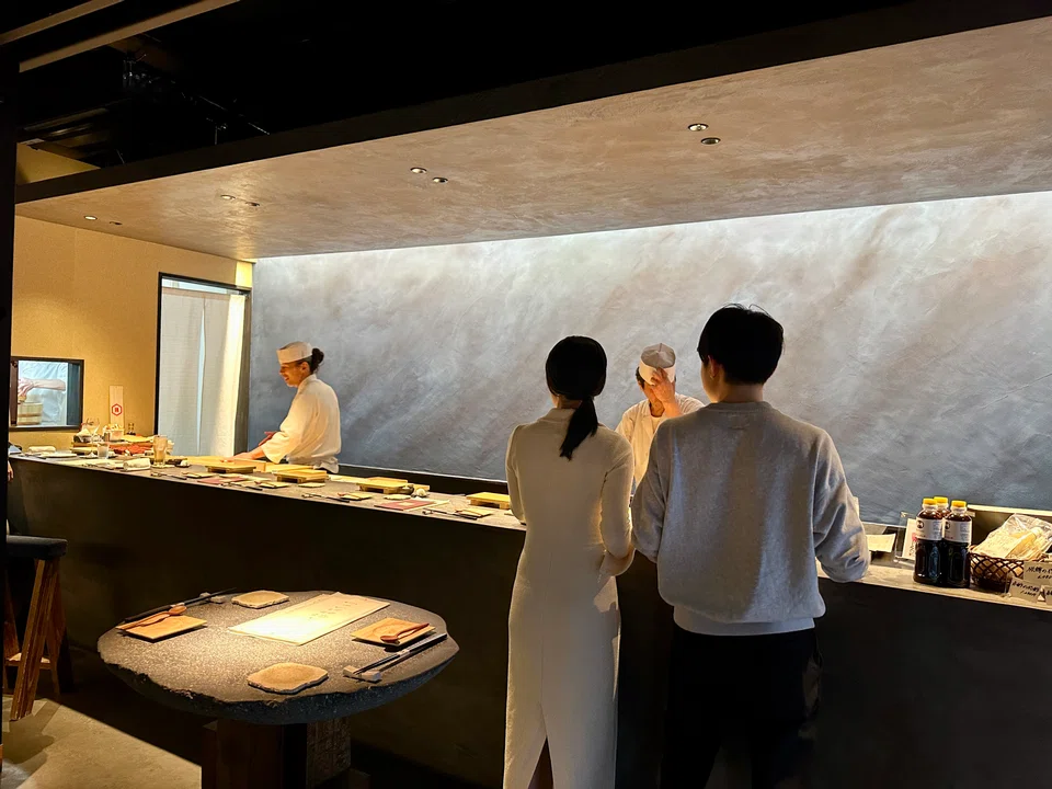 Standing Sushi Jinjin is styled like a cocktail bar.