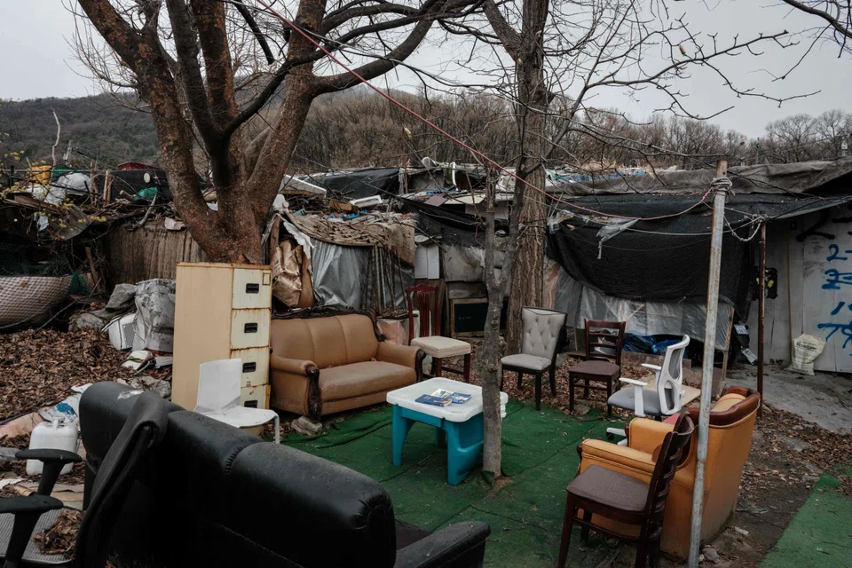 Some 2,400 people live in the shanty village of Guryong in Gangnam district, in shelters made from plywood, metal, sheets of plastic and cardboard boxes.