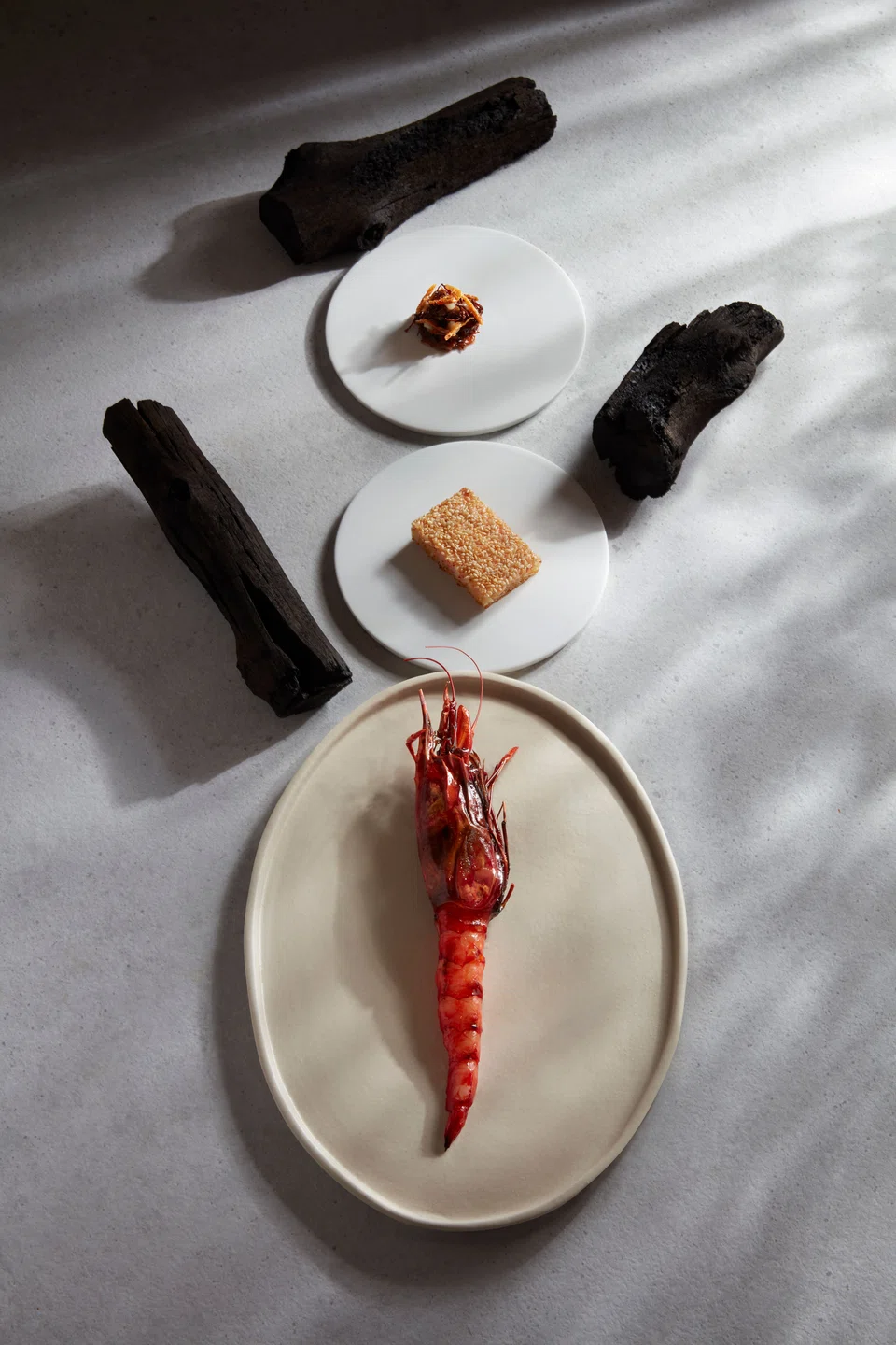Whole red prawn with sesame bread and XO sauce is a signature dish.
