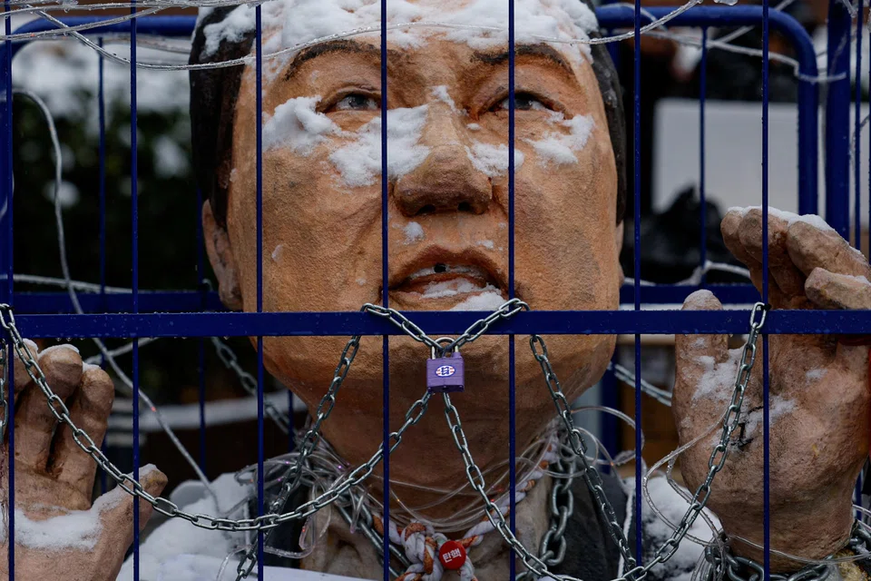 An effigy of suspended President Yoon Suk-yeol during a protest against him; Yoon plunged the country into political chaos on Dec 3 with the bungled martial law declaration and has since holed up in his residence, surrounded by hundreds of security officers resisting arrest efforts.