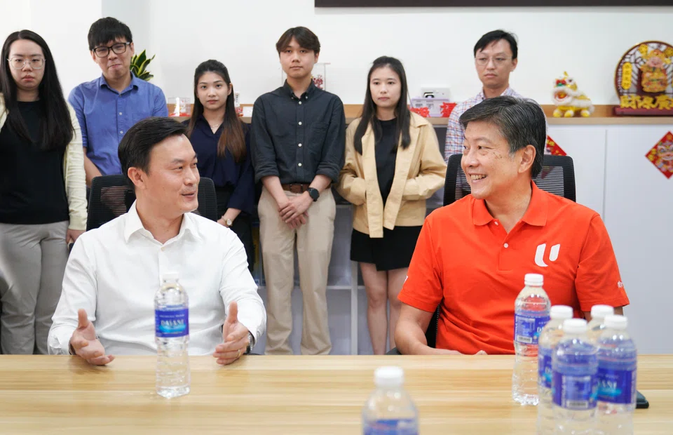 Managing partner of SIN Assurance PAC Dax Teo (left) with NTUC secretary-general Ng Chee Meng. Ng says feedback from the ground shows growing anxiety among PMEs over skills relevance and job security.