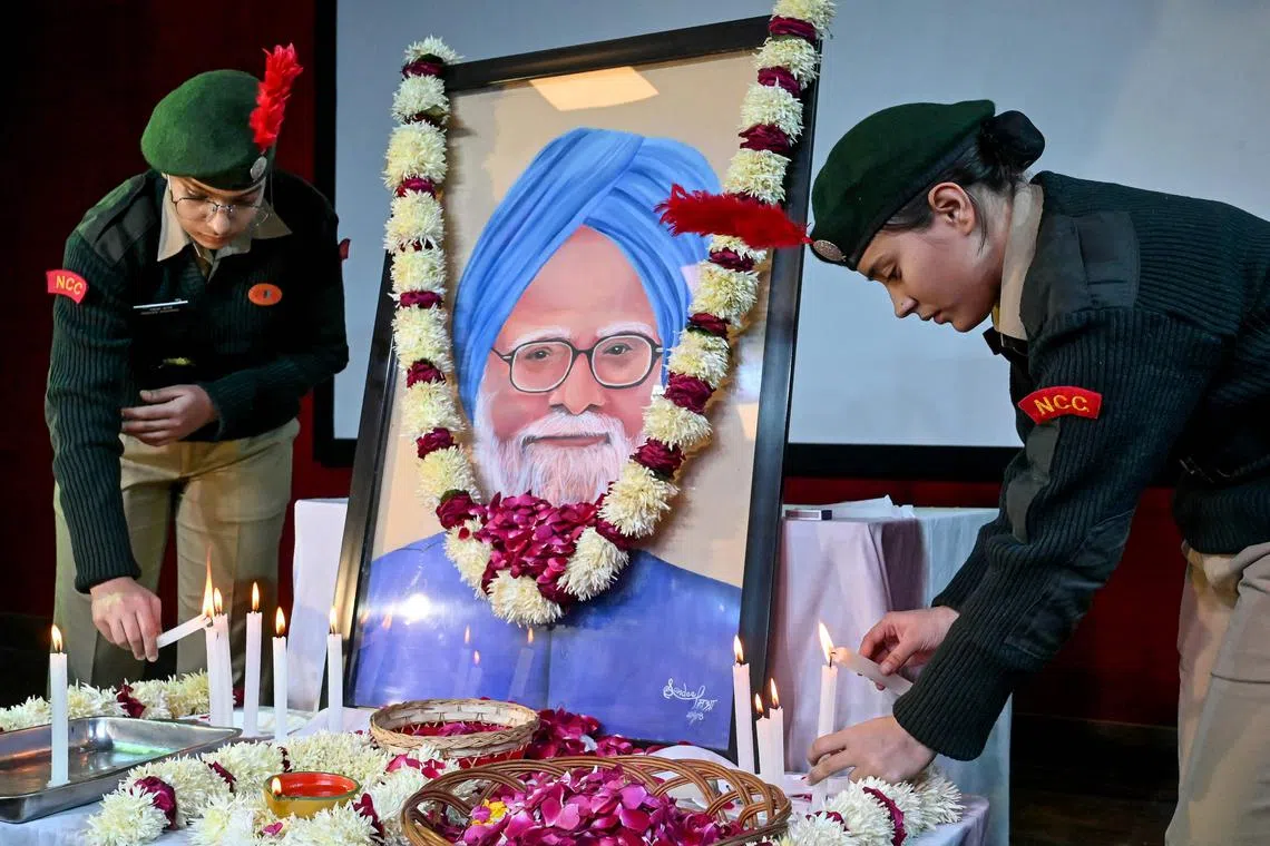 National Cadet Corps cadets light candles to pay their respects to India's late former prime minister Manmohan Singh at Hindu College, Singh's alma mater, in Amritsar.