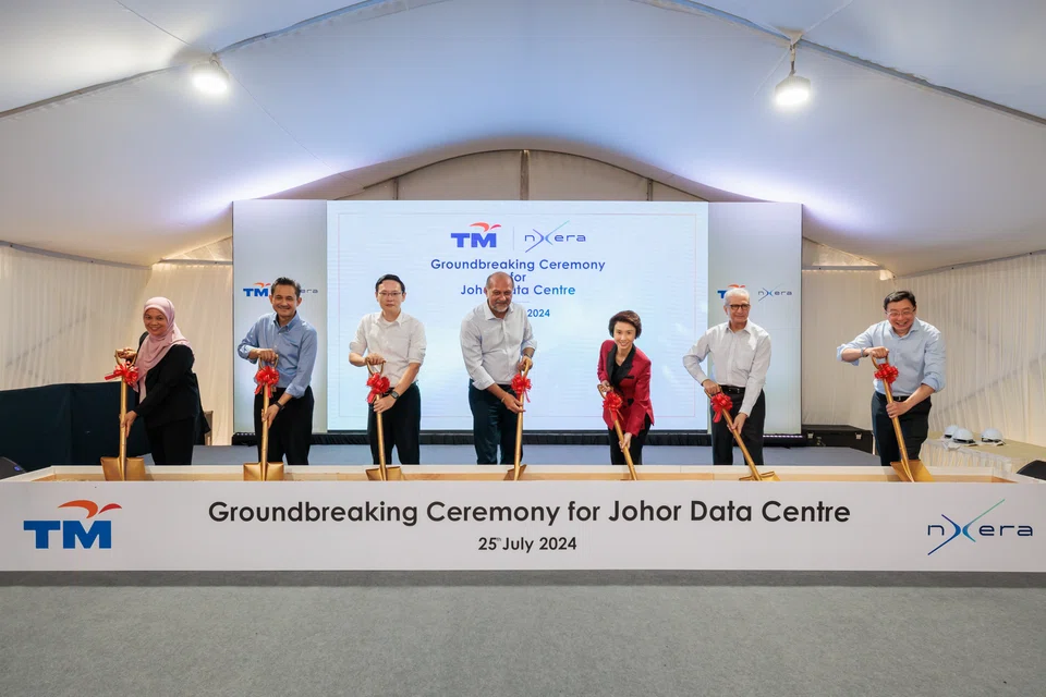 Representatives of Nxera and Telkon Malaysia (TM) and government officials at the groundbreaking ceremony in Iskandar Puteri on Thursday (Jul 25). Nxera CEO Bill Chang is first from right; TM's CEO Amar Huzaimi Md Deris is second from left. The guest of honour was Senior Minister of State for Trade and Industry Low Yen Ling (third from right).  