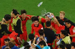 South Korea's Son Heung-min (centre) and his teammates celebrating wildly after they defeated Portugal 2-1 to qualify for the Round of 16 in the World Cup. South Korea will play Brazil on Dec 6 for a place in the quarter-finals
