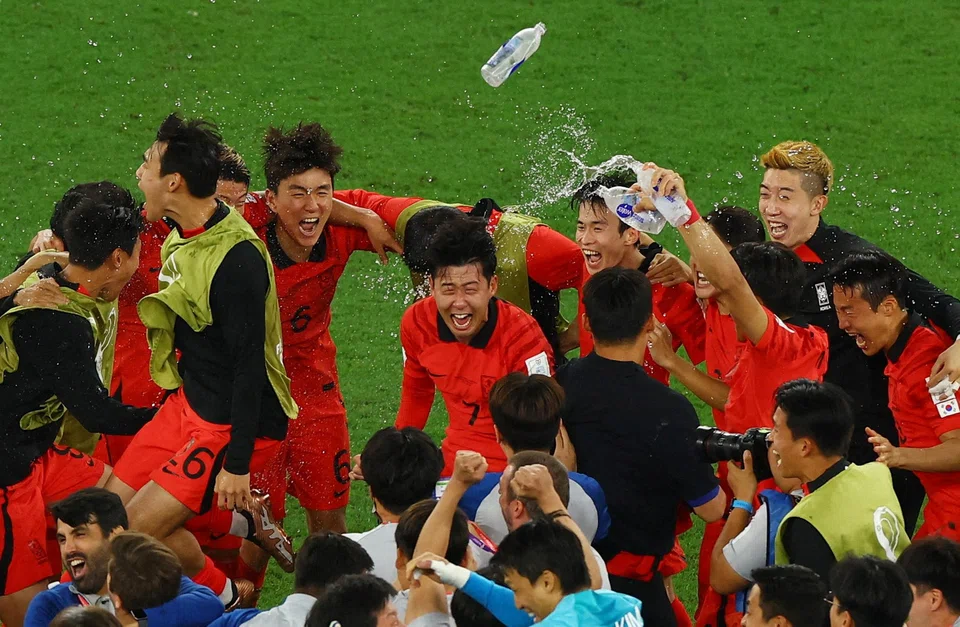 South Korea's Son Heung-min (centre) and his teammates celebrating wildly after they defeated Portugal 2-1 to qualify for the Round of 16 in the World Cup. South Korea will play Brazil on Dec 6 for a place in the quarter-finals