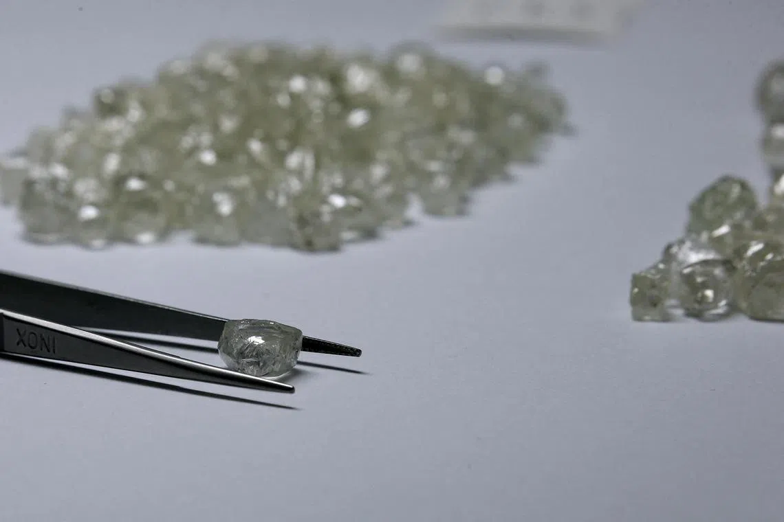 Diamonds are displayed at the De Beers Global Sightholder Sales in Botswana. Dealers say the price of mined, natural rough diamonds have fallen by an estimated 20 per cent to 30 per cent this year alone.
