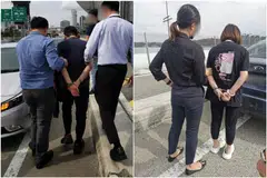 Ng Teck Lee, who was the CEO of then listed recycling firm Citiraya Industries, and his wife Thor Chwee Hwa being handed over to CPIB officers on Dec 3. 