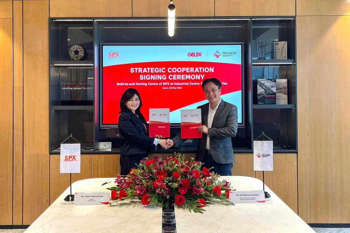 (left) Quyen Tran, SPX Express Vietnam director; Truong An Duong, Frasers Property Vietnam general manager of industrial & residential at the signing ceremony for SPX's largest automated sorting centre in South-east Asia