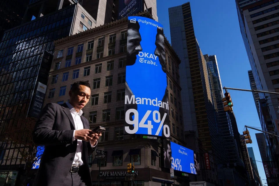 A Polymarket billboard in Times Square in New York. Polymarket is blocked in Singapore, since it is considered to be a provider of illegal gambling.