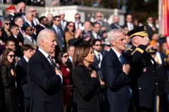 (From left) US President Joe Biden, Vice-President Kamala Harris and US secretary of Veterans Affairs Denis McDonough place their hands over their hearts during a wreath-laying ceremony at the Tomb of the Unknown Soldier at Arlington National Cemetery in Arlington, Virginia, Nov 11, 2024. 
