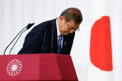Shigeru Ishiba, Japan's Prime Minister and leader of the ruling Liberal Democratic Party (LDP), bows to LDP lawmakers onstage after a press conference at the party's headquarters in Tokyo on Oct 28, 2024. Ishiba said he will stay in office despite his party losing its majority, saying he would not create a "political vacuum".