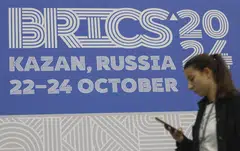 Members are split over efforts to reduce reliance on the US dollar as a global reserve currency, and on the wisdom of continued expansion of the group. 