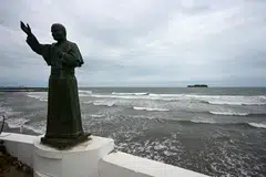 A statue of pope John Paul II is seen at a jetty as waves crash on the shore of the Gulf of Mexico, after newly sworn-in US President Donald Trump signed an executive order to change the name of the Gulf of Mexico to the Gulf of America, in Boca del Rio, Mexico, Jan 21, 2025.