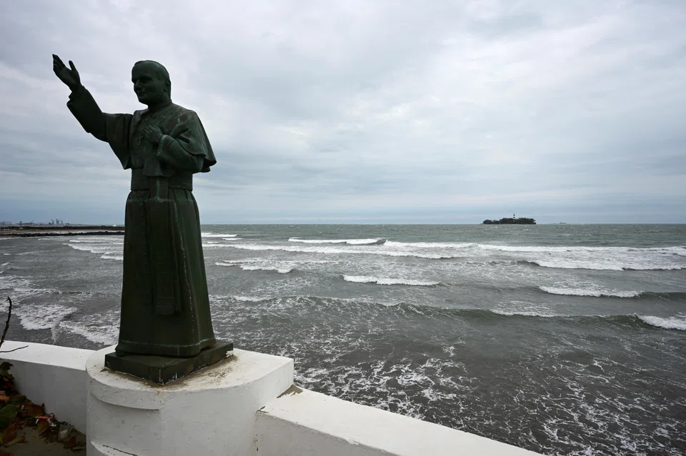 A statue of pope John Paul II is seen at a jetty as waves crash on the shore of the Gulf of Mexico, after newly sworn-in US President Donald Trump signed an executive order to change the name of the Gulf of Mexico to the Gulf of America, in Boca del Rio, Mexico, Jan 21, 2025.