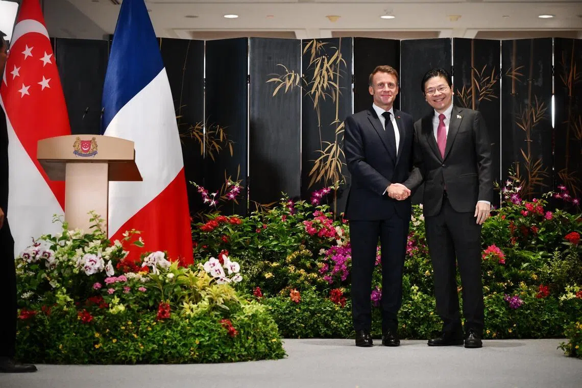 France's President Emmanuel Macron with Prime Minister Lawrence Wong during the French leader's official visit to Singapore in May 2025, when the two countries elevated their ties to that of a comprehensive strategic partnership. 