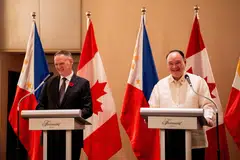 Philippine Defense Secretary Gilberto Teodoro Jr (right) and his Canadian counterpart David McGuinty at a joint press conference after signing the Philippines-Canada Status of Visiting Forces Agreement in Makati City, the Philippines.