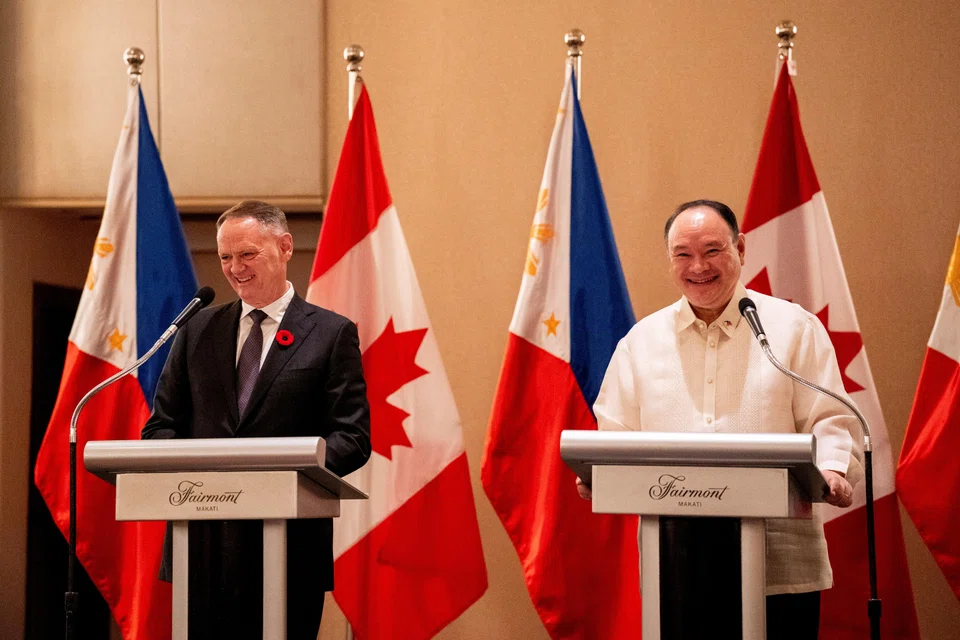 Philippine Defense Secretary Gilberto Teodoro Jr (right) and his Canadian counterpart David McGuinty at a joint press conference after signing the Philippines-Canada Status of Visiting Forces Agreement in Makati City, the Philippines.