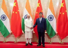 India's Prime Minister Narendra Modi shakes hands with Chinese President Xi Jinping. Modi is in China for the first time in seven years to attend a two-day meeting of the Shanghai Cooperation Organisation.
