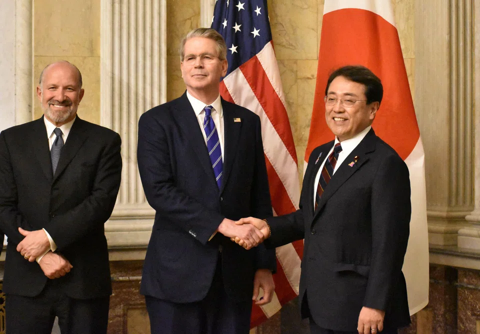 Japan's Economic Revitalisation Minister Ryosei Akazawa (right) poses with US Treasury Secretary Scott Bessent (centre) and Commerce Secretary Howard Lutnick (left) in Washington DC, United States, May 1, 2025.