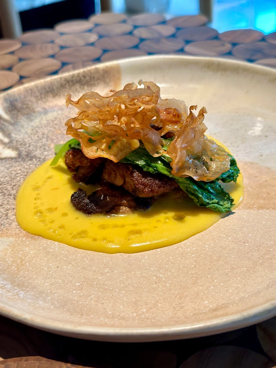 Lion's mane mushroom is seared and served with sweetcorn sauce.