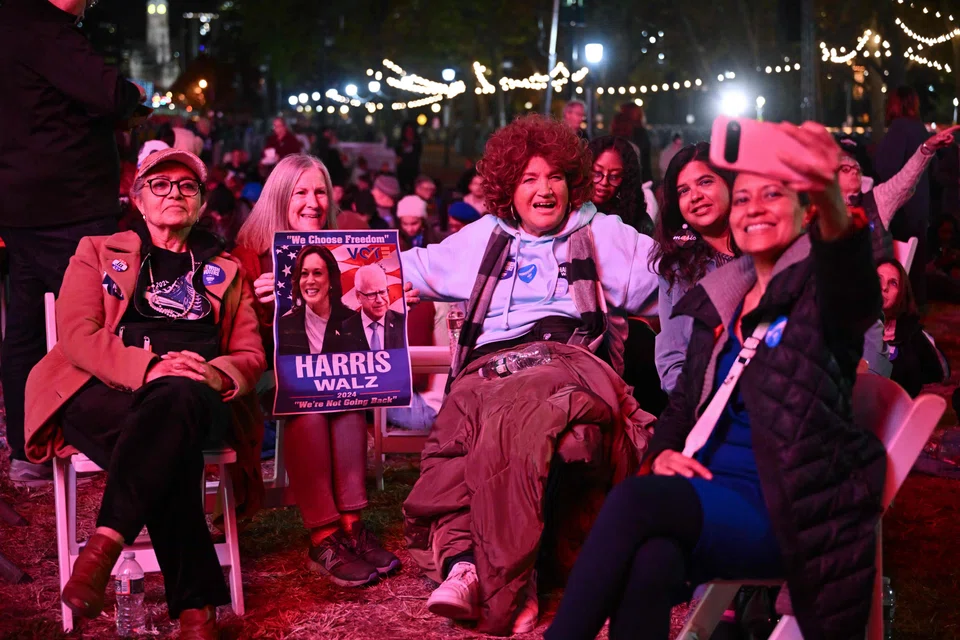 Supporters gather ahead of a campaign rally for US Vice-President and Democratic presidential candidate Kamala Harris in Philadelphia, Pennsylvania, Nov 4, 2024. 