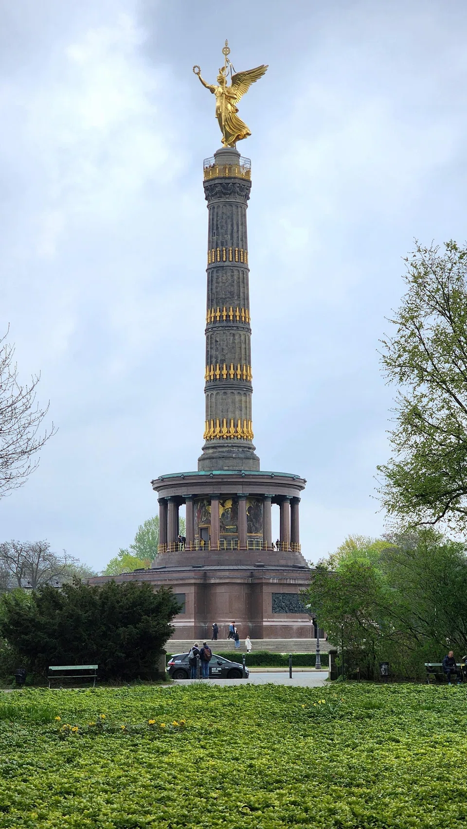 A golden statue of Victoria, the winged Roman goddess of victory, stands atop the Victory Column.